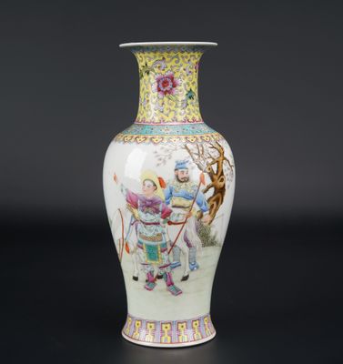 a vase with a picture of a man riding a horse on it