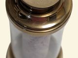 a close up view of a brass and glass object