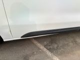 a picture of a white car parked in a parking lot