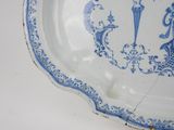 a blue and white plate with a design on it