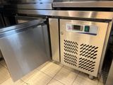 a stainless steel dishwasher and a stainless steel dishwasher in a commercial kitchen