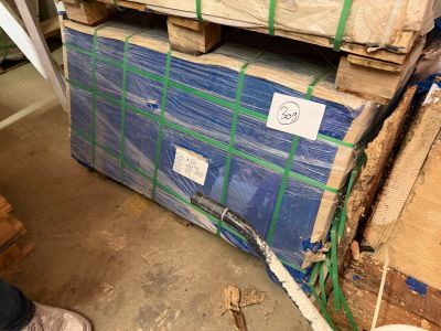 a stack of boxes and pallets sitting on the floor