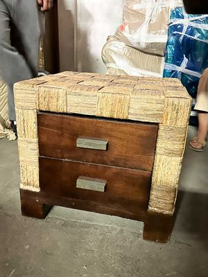 a small wooden table with a drawer on top of it