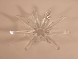 a glass starburst that is sitting on a table