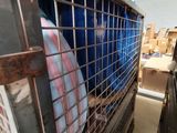 a cage that has a lot of items inside of it