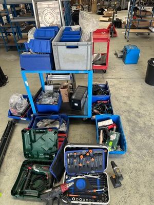 a lot of tools that are sitting on the floor