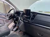 the interior of a car with a phone holder on the dashboard