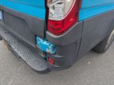 a close up of the rear end of a blue truck