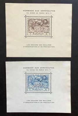 two envelopes with stamps on them on a black surface