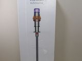the box of the dysonon vacuum is open on the table