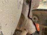 a close up of a car ' s tire with a wren