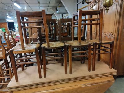 a lot of chairs that are stacked on top of each other