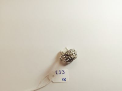 a silver bead on a white surface with a price tag