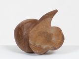 wooden sculpture of a bird on a white surface