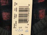 a label on the back of a jacket with a picture of a clock on it