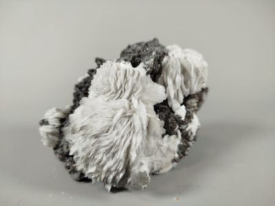 a close up of a piece of wool on a white surface