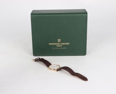 an image of a watch sitting on top of a green box