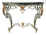 an ornate console table with a marble top and gold accents