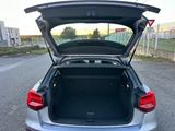 a car with its trunk open in the parking lot