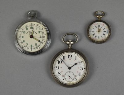 three different types of pocket watches are displayed on a gray surface