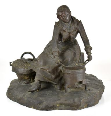 une statue représentant une femme assise sur un rocher avec un chien