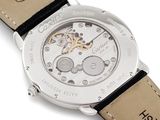 an image of a close up of a watch on a white surface