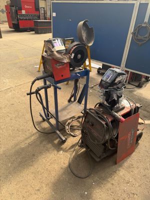 a machine that is sitting on the ground next to other machines