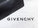 givenchy black leather clutch bag on a white t - shirt