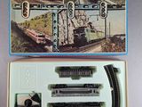 a box with a train set in it on a table