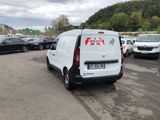 a white van that is parked in a parking lot