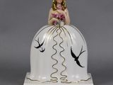a porcelain figurine of a woman in a wedding dress