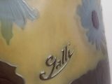 a vase that has a name painted on it
