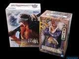 two boxes of one piece action figures sitting next to each other