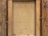 an old wooden picture frame with a rope hanging from it ' s side