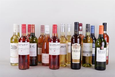 many bottles of wine that are lined up on the table