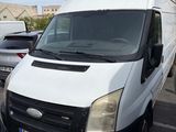 a white van that is parked in a parking lot