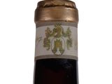 a bottle of wine that is sitting on a table