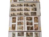 a lot of old postcards on a white surface