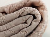 a close up of a pile of blankets on a table