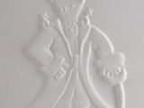 a close up of a carving of a man holding a skull