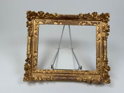 a picture of a gold frame with a mirror in it