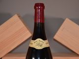a bottle of wine that is sitting on a table