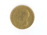 a gold coin with a picture of a man ' s face on it