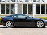 a black sports car parked in front of a building