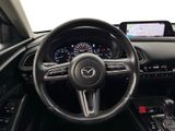 the interior of a car with a steering wheel, dashboard, and dash board