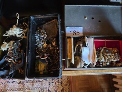 a box with a bunch of jewelry inside of it