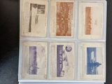 several old baseball cards sitting on top of a table next to each other