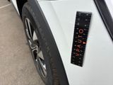 a close up of a car with a ruler on the side of it