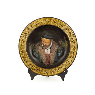 a picture of a decorative plate with a picture of a man on it