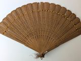 a fan that is hanging on the wall